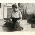Belva Nelson with squirrel on Nelsons Resort aka Crane Lake Cabins lodge steps