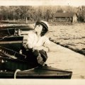 Belva Nelson on dock with Echo cabin in background