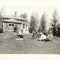 Millie and John Nelson with Axel Norlund in front of lodge early 1930s