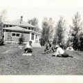Millie and John Nelson with Axel Norlund in front of lodge early 1930s