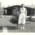 Belva Nelson in nurses uniform in front of store early 1940s