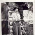 Betty Berger in front of cabin